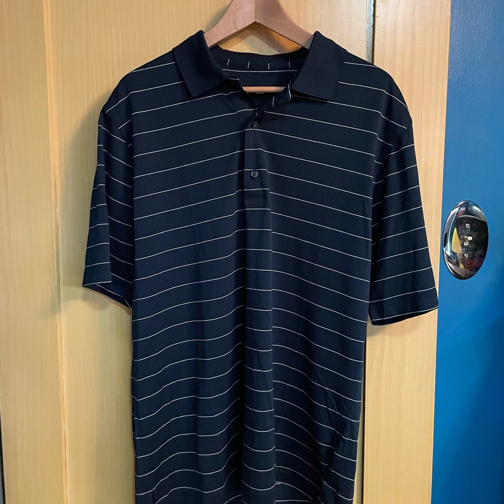 “Play Dry” polo. No size on shirt. Medium size measurements